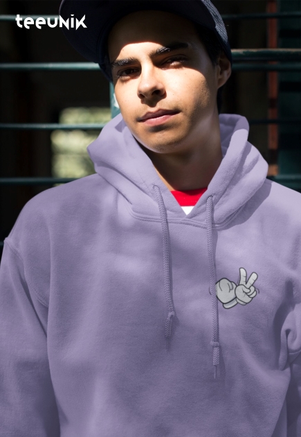 Close-up of the 'Rebel Dreams' graffiti artwork featuring bold text with a peace and rebel sign on a lavender hoodie.